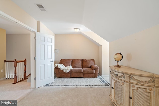 13945 Hollow Wind Way Unit 201, Woodbridge, VA 22191 - living area featuring light colored carpet, vaulted ceiling, an upstairs landing, and visible vents
