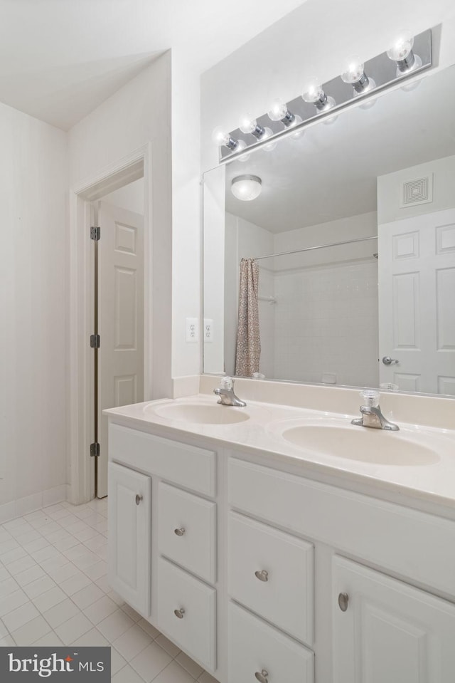 13945 Hollow Wind Way Unit 201, Woodbridge, VA 22191 - full bathroom featuring tile patterned floors, visible vents, a sink, and double vanity