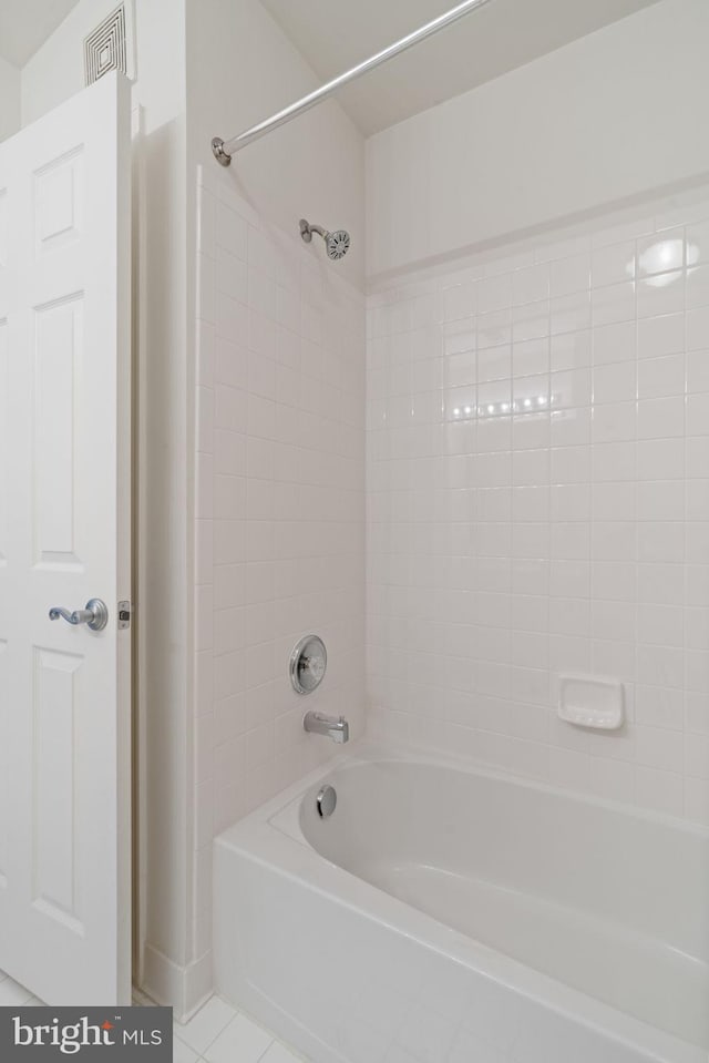 13945 Hollow Wind Way Unit 201, Woodbridge, VA 22191 - bathroom with tile patterned floors, shower / bathtub combination, and visible vents