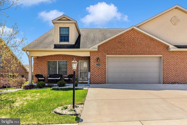 view of front of home with a front yard, an attached garage, covered porch, brick siding, and driveway