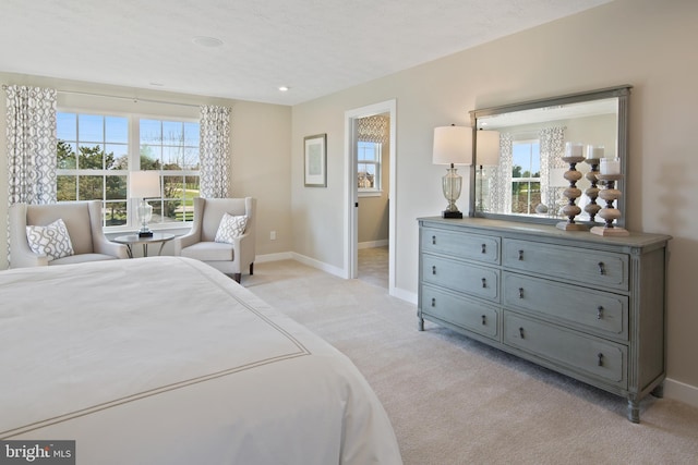 bedroom featuring light colored carpet, baseboards, and recessed lighting