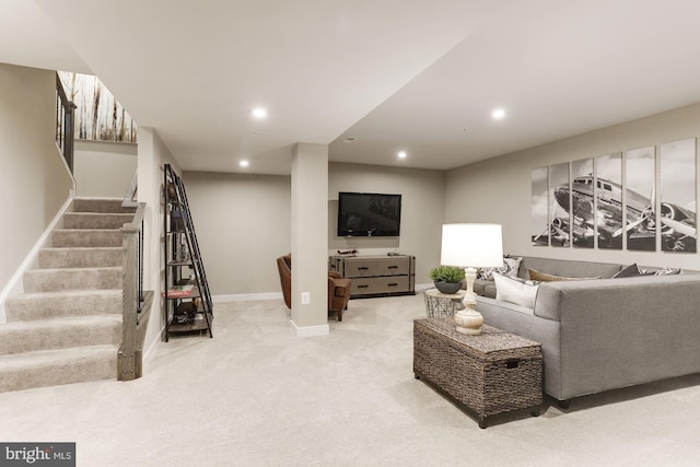 carpeted living room featuring stairs, baseboards, and recessed lighting