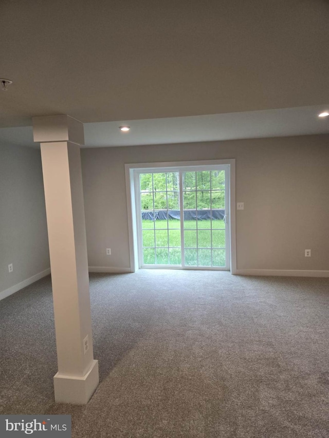 carpeted empty room with baseboards and recessed lighting