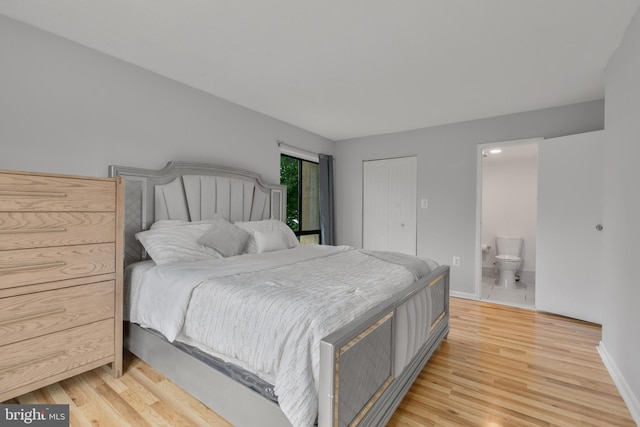 623 Center St Unit 101, Herndon, VA 20170 - bedroom with light wood-style flooring, connected bathroom, and a closet