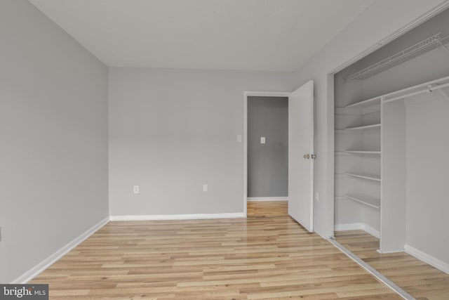 623 Center St Unit 101, Herndon, VA 20170 - unfurnished bedroom with light wood finished floors and a closet