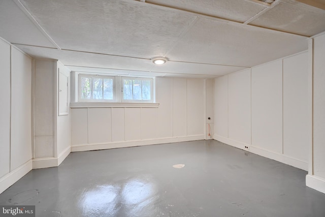 basement featuring a decorative wall