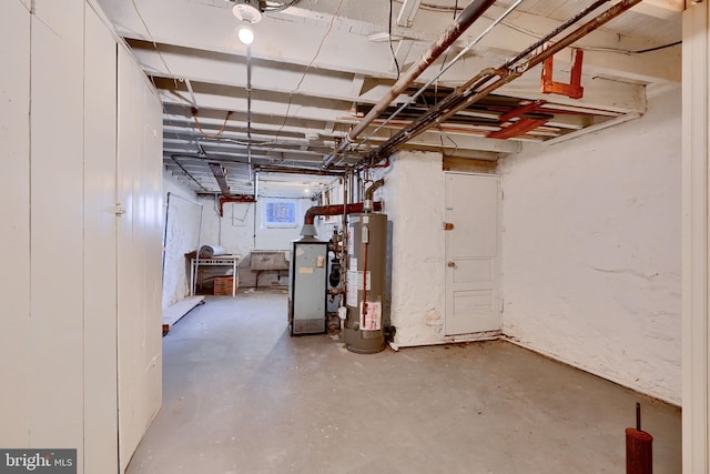 unfinished basement featuring gas water heater