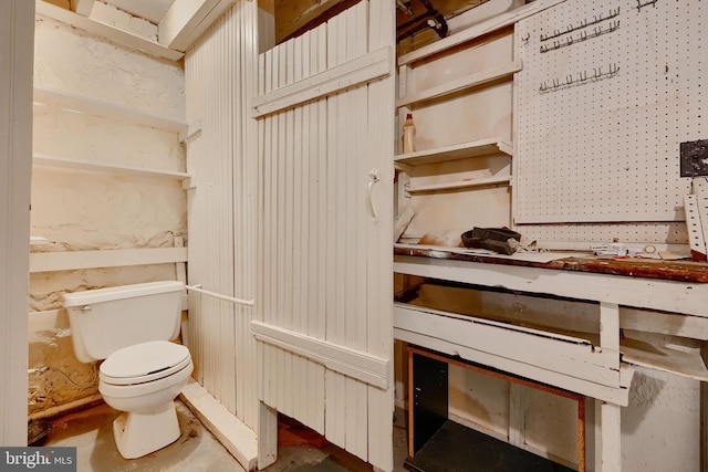 details featuring concrete flooring and toilet