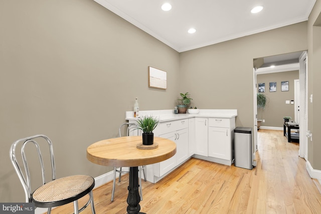 1936 Capitol Ave NE, Washington, DC 20002 - kitchen with ornamental molding, white cabinetry, light countertops, recessed lighting, and light wood-style flooring