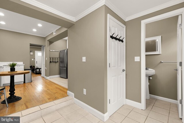 1936 Capitol Ave NE, Washington, DC 20002 - hall featuring light tile patterned flooring, crown molding, recessed lighting, and baseboards