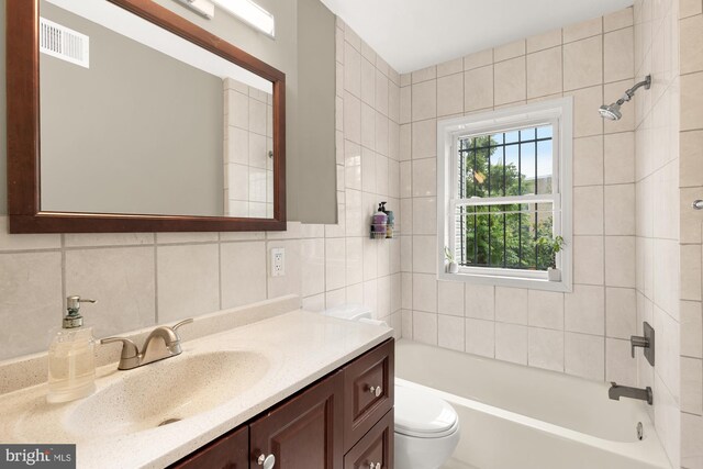 1936 Capitol Ave NE, Washington, DC 20002 - full bathroom with vanity, toilet, and tasteful backsplash