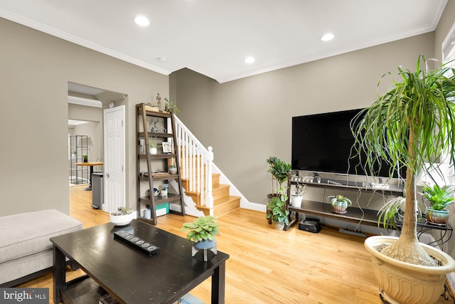 1936 Capitol Ave NE, Washington, DC 20002 - living room with wood finished floors, stairs, crown molding, recessed lighting, and baseboards
