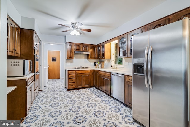 36035 Army Navy Dr, Mechanicsville, MD 20659 - kitchen with appliances with stainless steel finishes, under cabinet range hood, a sink, a ceiling fan, and light countertops