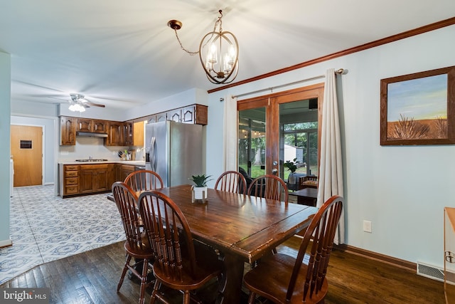 36035 Army Navy Dr, Mechanicsville, MD 20659 - dining area with hardwood / wood-style flooring, a chandelier, baseboards, a ceiling fan, and ornamental molding