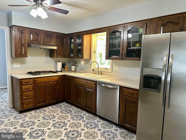 36035 Army Navy Dr, Mechanicsville, MD 20659 - kitchen with appliances with stainless steel finishes, a sink, under cabinet range hood, light countertops, and a ceiling fan