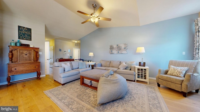 living area featuring vaulted ceiling, light wood-style floors, ceiling fan, baseboards, and visible vents