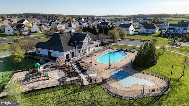 birds eye view of property with a residential view