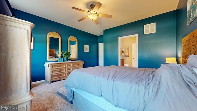 bedroom with visible vents, a ceiling fan, connected bathroom, baseboards, and carpet flooring