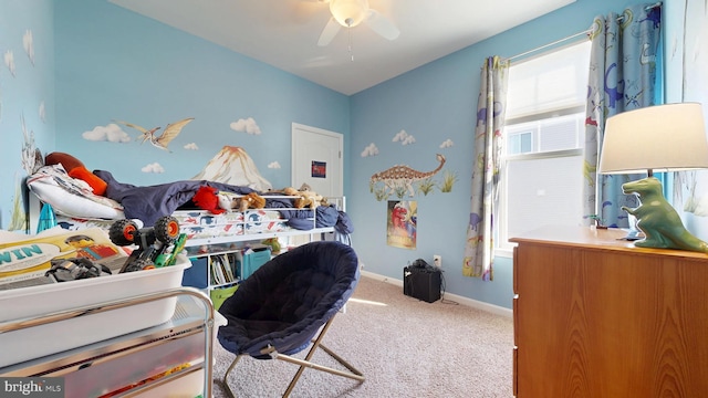 carpeted bedroom with baseboards and ceiling fan