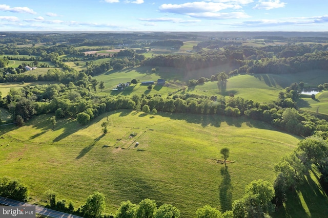 birds eye view of property with a rural view