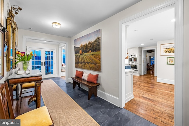 interior space featuring french doors, baseboards, and recessed lighting