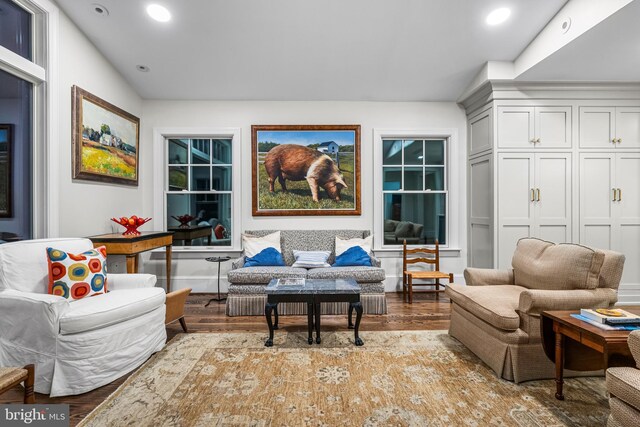 living area with recessed lighting and wood finished floors