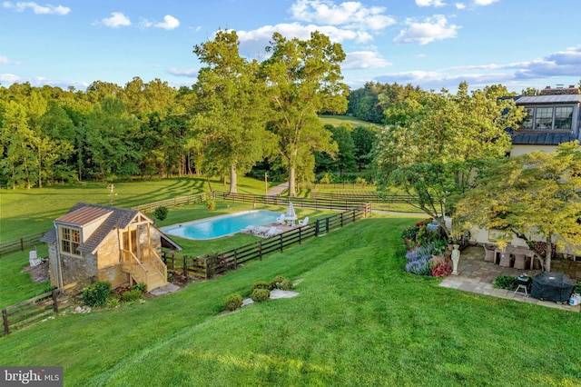 exterior space with a patio, fence, and an outbuilding