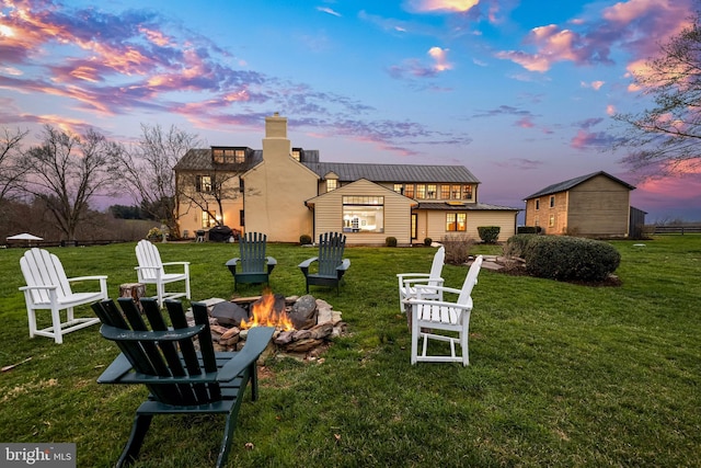 view of yard with a fire pit