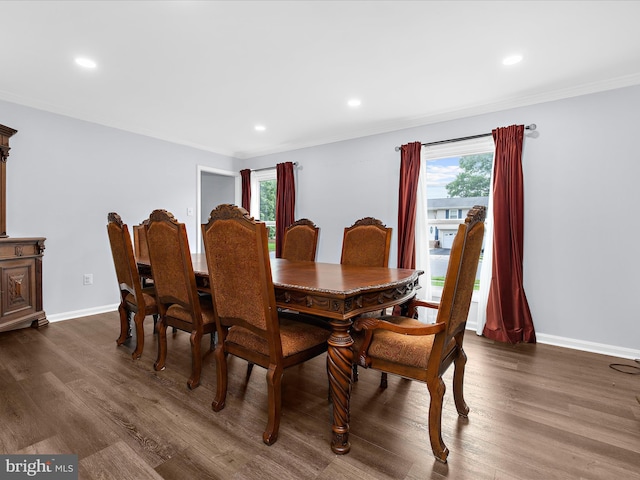 dining area with healthy amount of natural light, ornamental molding, dark wood-type flooring, baseboards, and recessed lighting