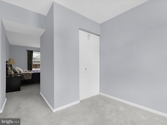 bedroom with carpet and baseboards