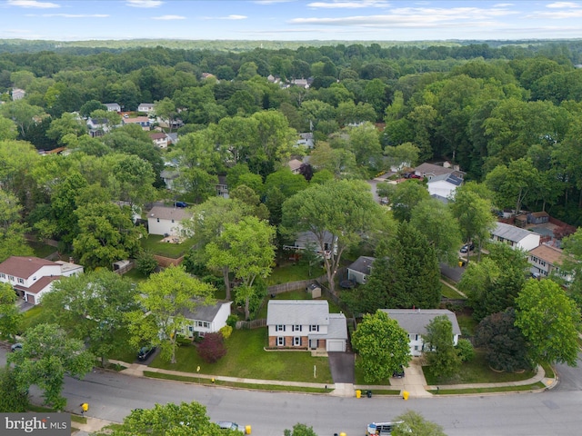 aerial view of residential area with a heavily wooded area