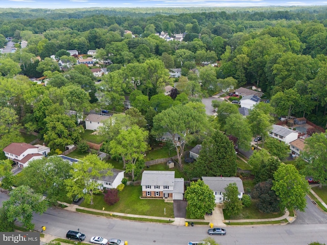 aerial view of residential area featuring a heavily wooded area