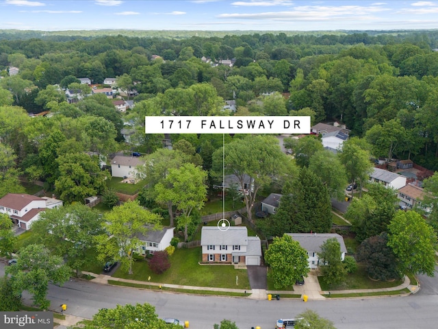 aerial view of residential area with a forest