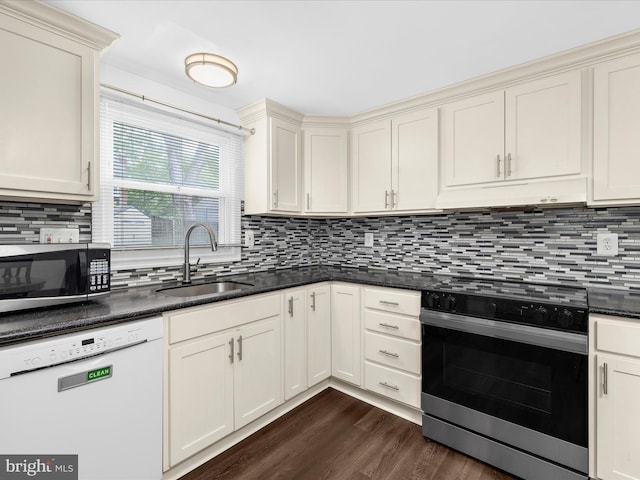 kitchen with dishwasher, electric range, a sink, stainless steel microwave, and under cabinet range hood