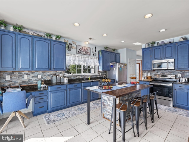 200 Rubens Cir, Martinsburg, WV 25403 - kitchen with blue cabinetry and appliances with stainless steel finishes