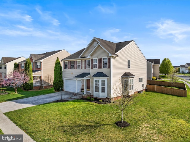 200 Rubens Cir, Martinsburg, WV 25403 - traditional home featuring concrete driveway, a garage, a residential view, and a front lawn