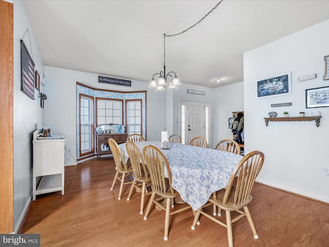 200 Rubens Cir, Martinsburg, WV 25403 - dining room featuring baseboards, an inviting chandelier, and wood finished floors