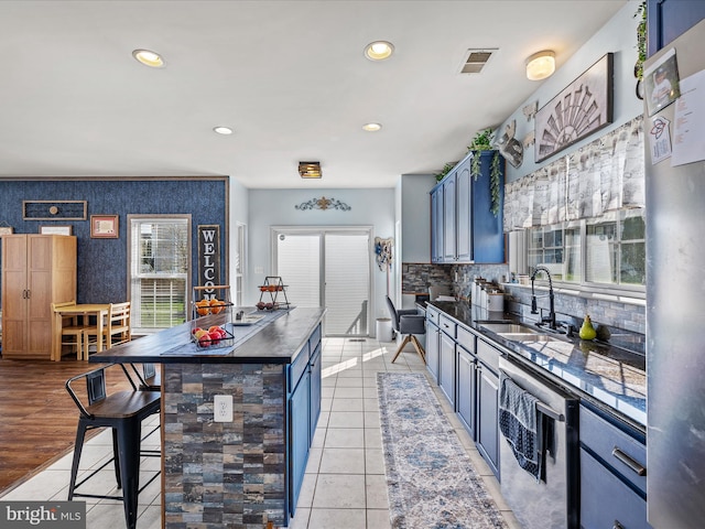 200 Rubens Cir, Martinsburg, WV 25403 - kitchen featuring wallpapered walls, dark countertops, visible vents, beverage cooler, and a sink