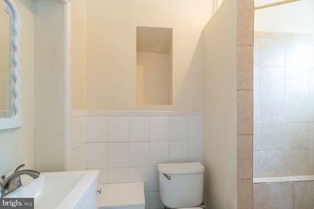 2607 Quantico Ave, Baltimore, MD 21215 - bathroom featuring toilet, tile walls, and vanity