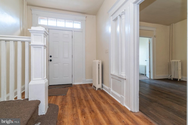 2607 Quantico Ave, Baltimore, MD 21215 - entryway featuring wood finished floors, baseboards, and radiator heating unit