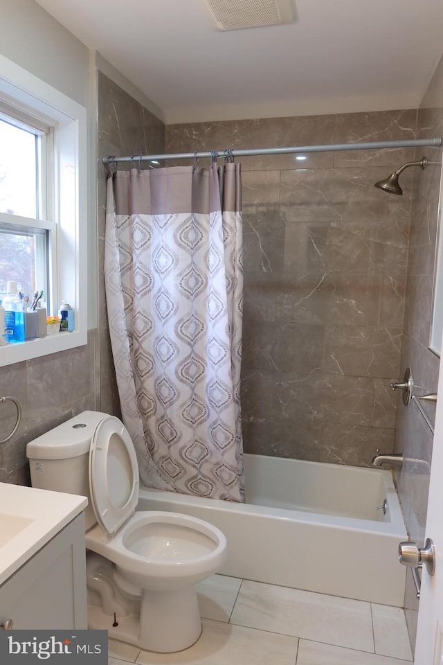 bathroom with shower / bath combo, visible vents, tile patterned flooring, and vanity