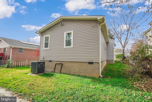 817 57th Pl, Fairmount Heights, MD 20743 - view of home's exterior featuring a yard, fence, and cooling unit
