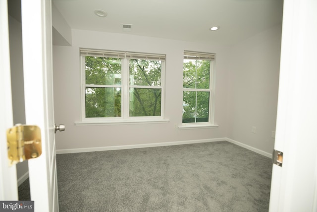 empty room featuring recessed lighting, visible vents, baseboards, and carpet floors