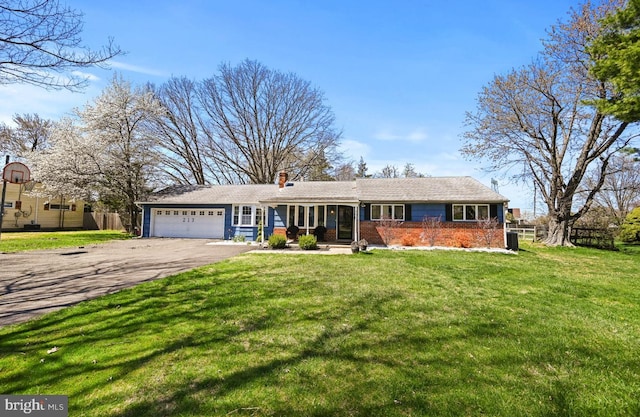 213 Stump Rd, North Wales, PA 19454 - ranch-style house featuring a front yard, a chimney, brick siding, an attached garage, and driveway