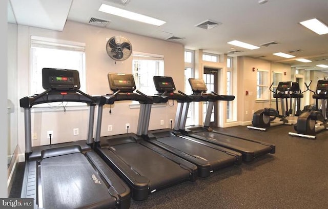 workout area with baseboards and visible vents