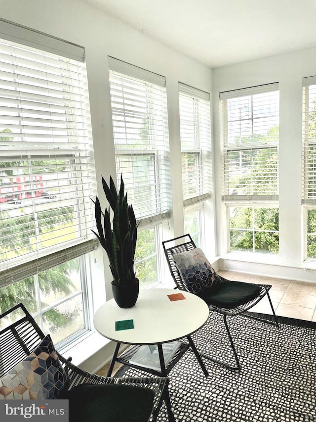 sunroom / solarium featuring tile patterned floors
