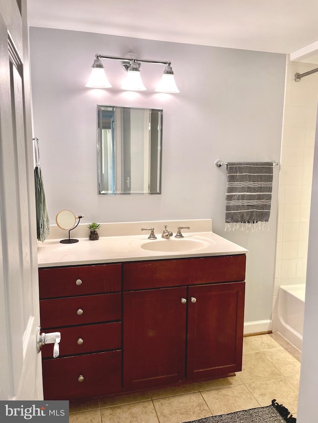 bathroom with shower / bath combination, vanity, and tile patterned flooring