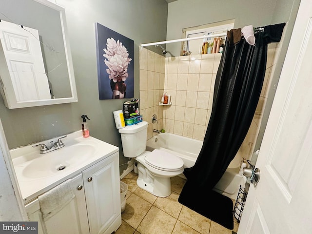 bathroom featuring toilet, shower / bath combo, vanity, and tile patterned flooring