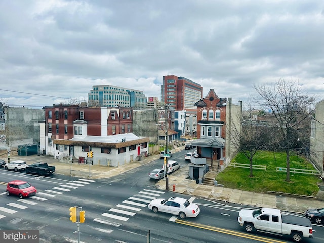 view of street with sidewalks and curbs