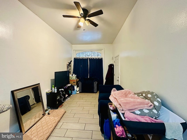 bedroom with vaulted ceiling and a ceiling fan